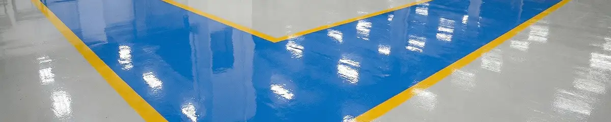A factory floor professionally covered and marked with epoxy flooring in Louisville, KY