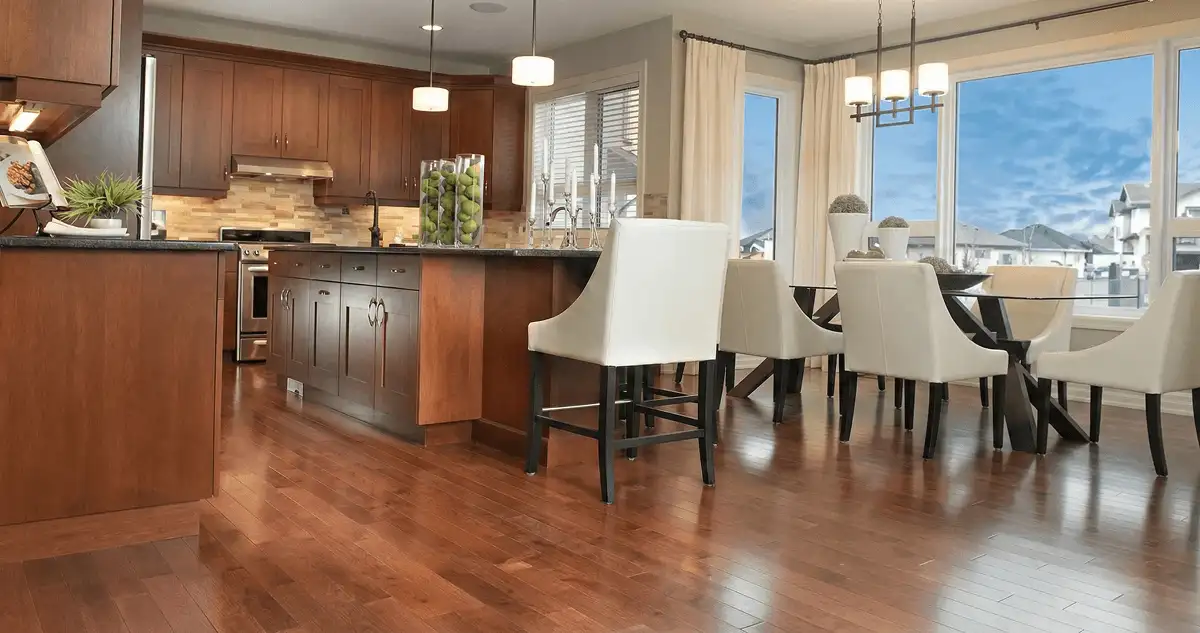 A modern kitchen with professionally installed wood flooring in Louisville, KY