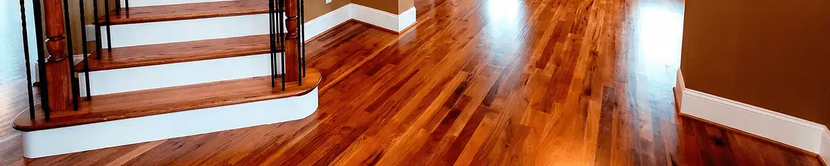 Base floor of a staircase with professionally restored wood flooring in Louisville KY