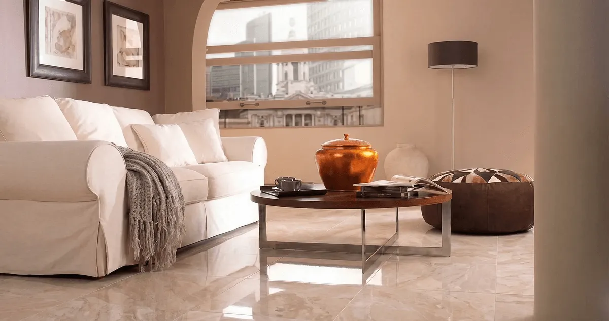 Modern living room with professionally installed marble flooring, a beige sofa, coffee table in Louisville, KY