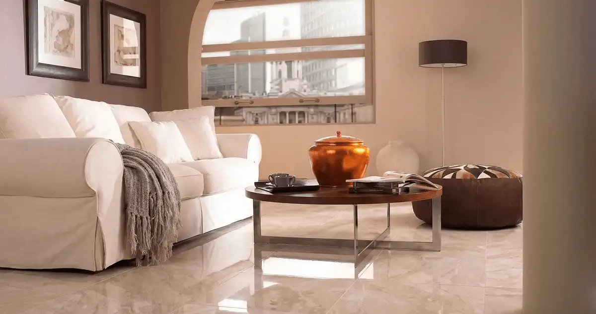 Modern living room with professionally installed marble flooring, a beige sofa, coffee table in Louisville, KY