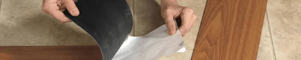 A professional installing vinyl flooring in Louisville, KY
